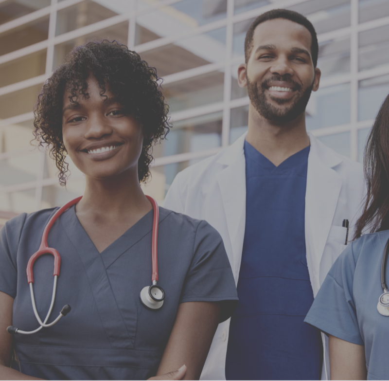 Two healthcare providers smiling